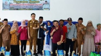 Anggota DPRD Jambi Robinson Sirait Dampingi PJ Bupati Serahkan Bantuan